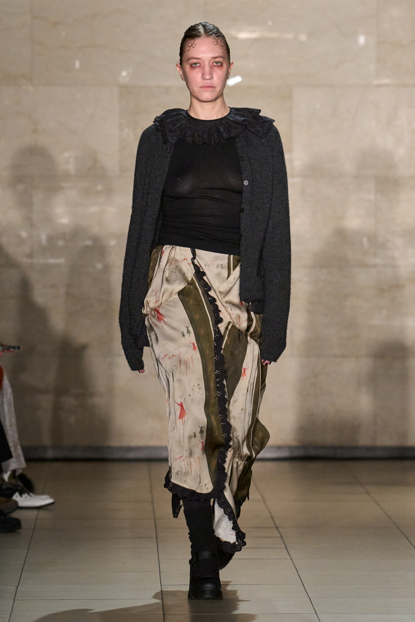 Runway look: black knit top with a long printed skirt, Meruert Tolegen Fall/Winter 2025