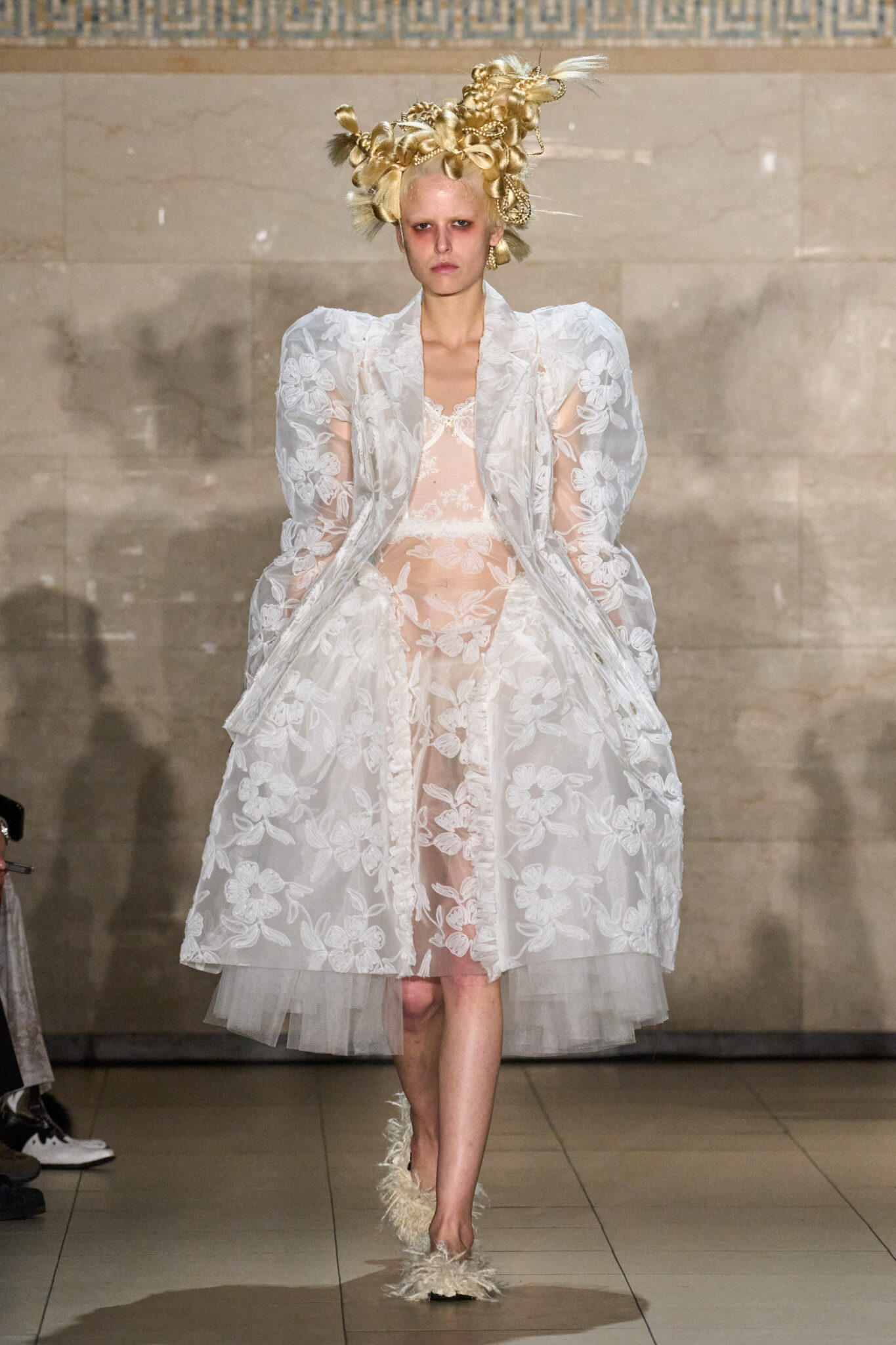 Runway look: white lace dress with a gold headpiece, Meruert Tolegen Fall/Winter 2025