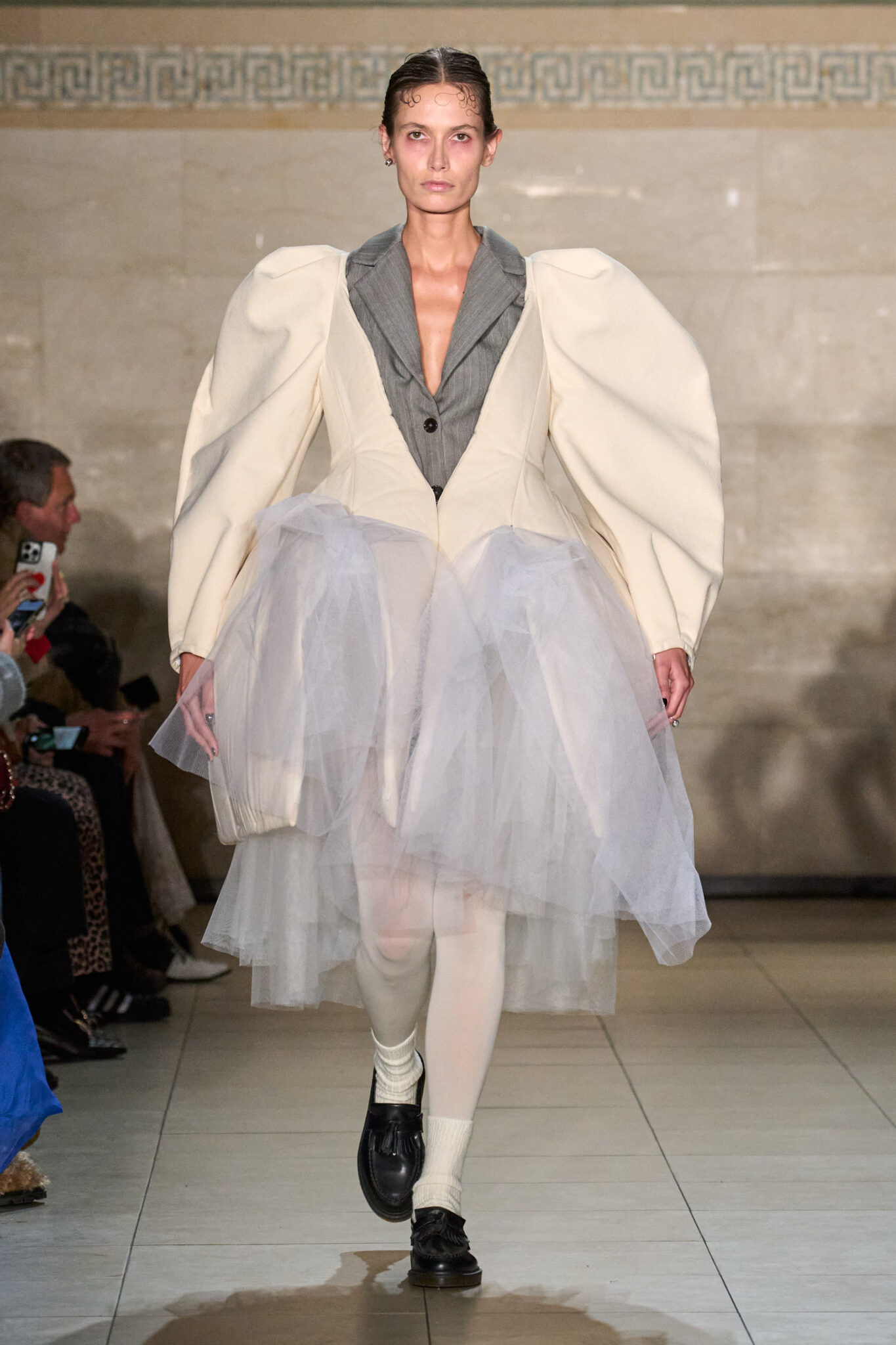Runway look: cream puff-shoulder jacket over a lilac tulle skirt, Meruert Tolegen Fall/Winter 2025