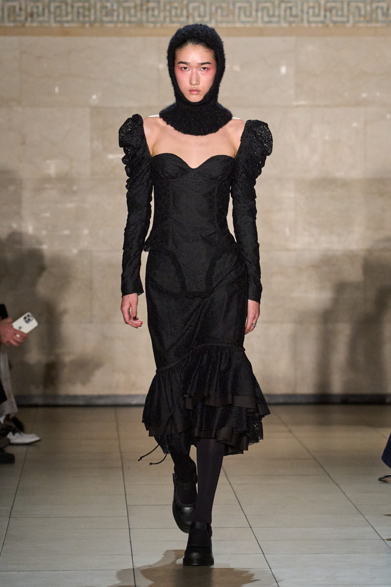 Runway look: black hooded dress with a ruffled hem, Meruert Tolegen Fall/Winter 2025